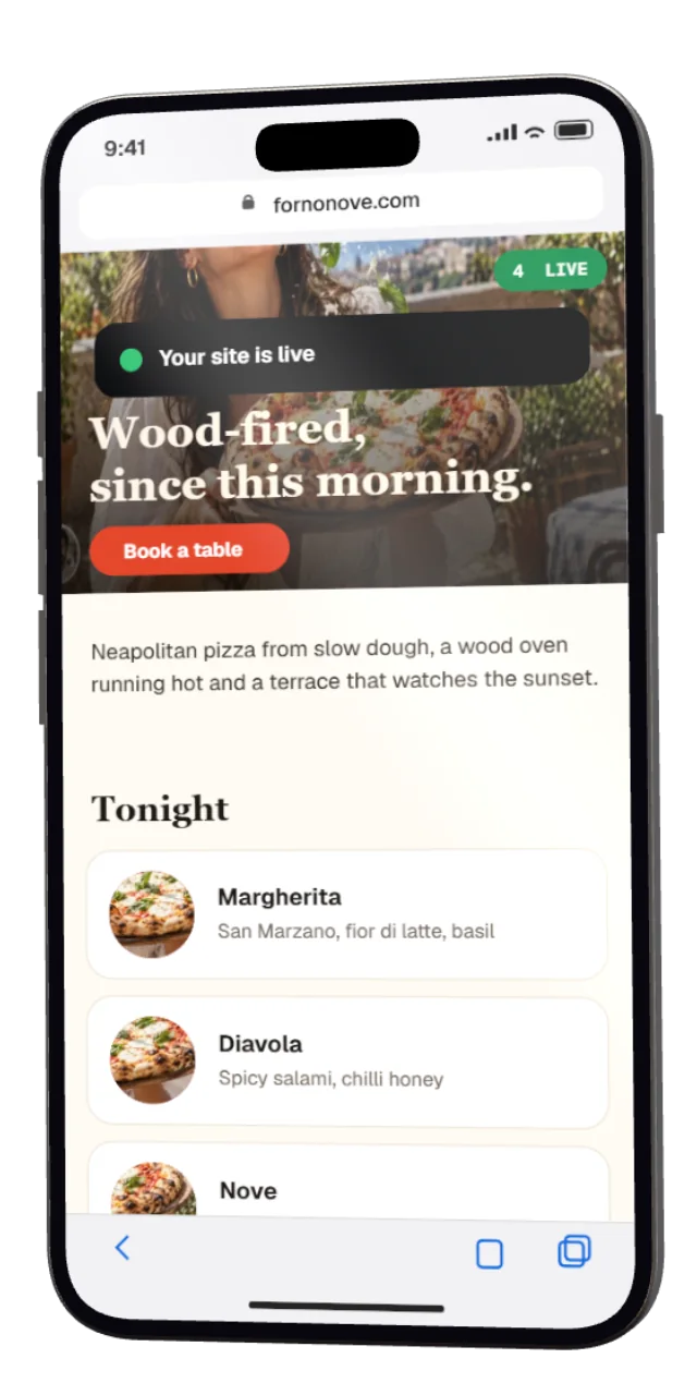 A phone showing a finished restaurant website